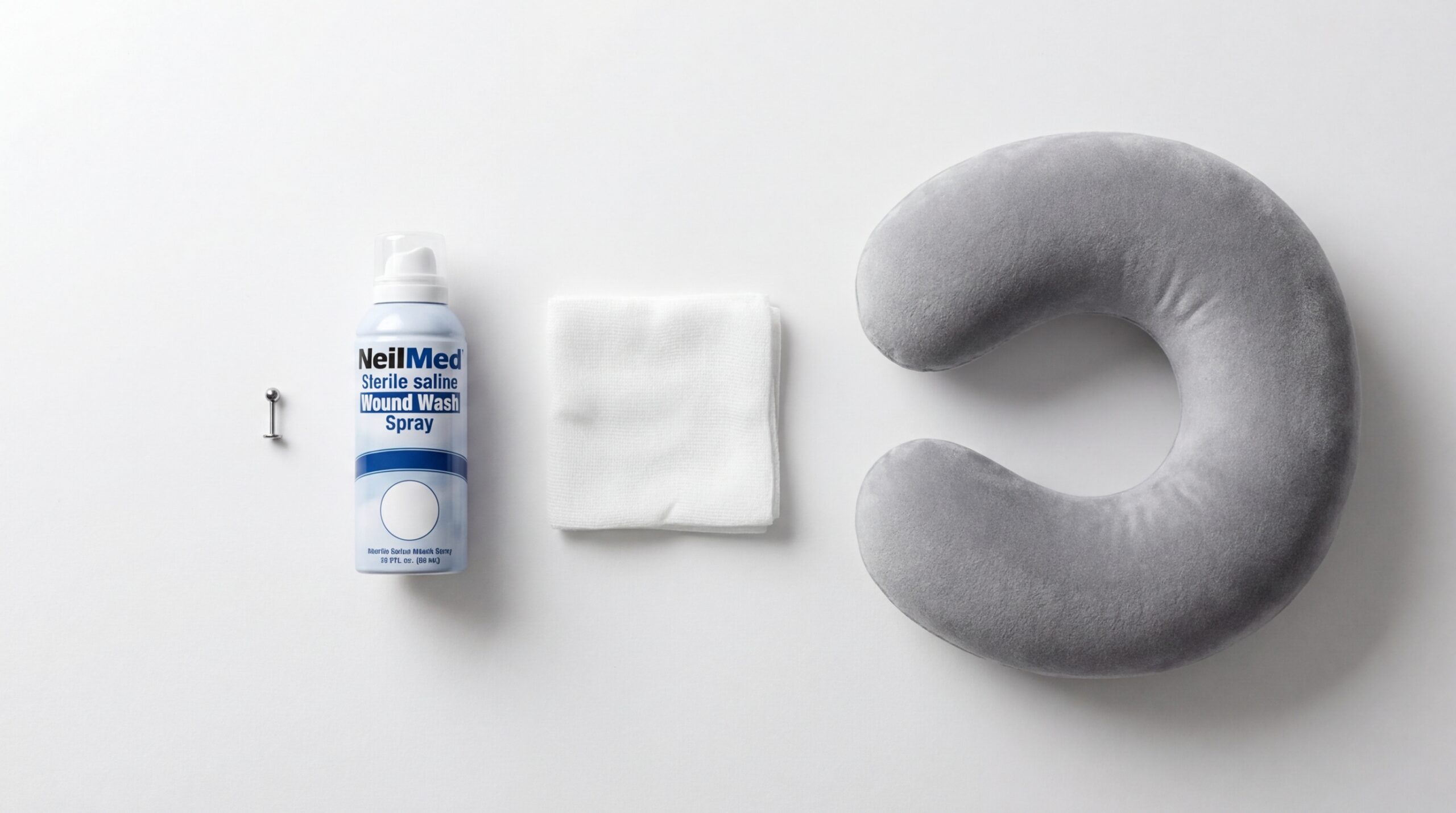 Piercing aftercare essentials for preventing bumps and keloids — saline spray and titanium jewelry