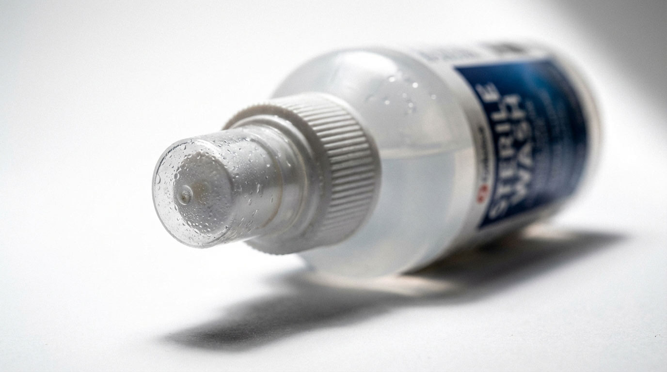 Saline wound wash spray bottle — sterile piercing aftercare solution